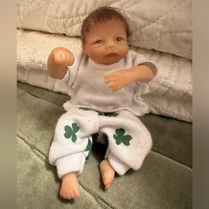 Mini Ashton Drake Reborn Doll with White Outfit and Green Clover Design